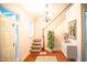 Entryway boasts gleaming floors, staircase, chandelier, and abundant natural light at 7320 Dunsany Ct, Wake Forest, NC 27587