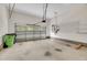 Spacious two car garage featuring peg board, shelving, and a garage door opener at 7320 Dunsany Ct, Wake Forest, NC 27587