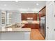 Spacious kitchen showcasing granite countertops, stainless steel appliances, and natural lighting at 7320 Dunsany Ct, Wake Forest, NC 27587
