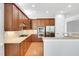 A spacious kitchen with a center island, stainless steel appliances, and granite countertops at 7320 Dunsany Ct, Wake Forest, NC 27587