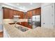 Beautiful kitchen featuring granite countertops, stainless steel appliances, and custom wood cabinets at 7320 Dunsany Ct, Wake Forest, NC 27587