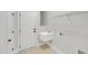 Practical laundry area with utility sink and storage shelving at 7320 Dunsany Ct, Wake Forest, NC 27587
