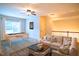 Cozy living room with plush seating, pool table, and natural light at 7320 Dunsany Ct, Wake Forest, NC 27587