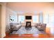 A spacious living room designed with comfortable sofas, accent chairs, and a fireplace for a cozy atmosphere at 7320 Dunsany Ct, Wake Forest, NC 27587