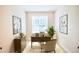 Home office is complete with decor, desk, chair, and artwork to create a productive workspace at 7320 Dunsany Ct, Wake Forest, NC 27587