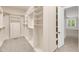 Spacious walk-in closet with custom shelving and ample storage space at 7320 Dunsany Ct, Wake Forest, NC 27587