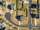 An aerial view displays the home's position in a quiet neighborhood layout at 8217 Cannon Grove Dr, Willow Springs, NC 27592
