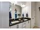 Bathroom with a double vanity, granite counters, and two sinks at 8217 Cannon Grove Dr, Willow Springs, NC 27592