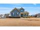 Charming two-story home featuring a welcoming front porch and well-maintained landscaping at 8217 Cannon Grove Dr, Willow Springs, NC 27592
