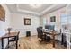 Bright office with tray ceilings, wainscoting, and built-in desk at 8217 Cannon Grove Dr, Willow Springs, NC 27592