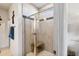 Shower with bench, tiled walls, and glass doors at 8217 Cannon Grove Dr, Willow Springs, NC 27592