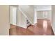 Hardwood floor entryway with staircase leading upstairs at 907 Sweet Gale Dr, Durham, NC 27704