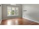 Bright bedroom with hardwood floors and large windows at 101 Stefi Ct, Garner, NC 27529