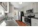 Modern kitchen with stainless steel appliances and gray countertops at 101 Stefi Ct, Garner, NC 27529