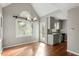 Eat-in kitchen with hardwood floors, gray cabinets, and a vaulted ceiling at 101 Stefi Ct, Garner, NC 27529