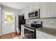 Kitchen with stainless steel appliances and gray countertops at 101 Stefi Ct, Garner, NC 27529