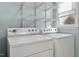 Laundry room with washer and dryer and overhead shelving at 101 Stefi Ct, Garner, NC 27529