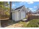 Gray storage shed with double doors and small deck at 101 Stefi Ct, Garner, NC 27529