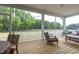 Relaxing screened porch overlooking a wooded backyard at 1051 Cross Rail Ln, Raleigh, NC 27603