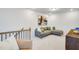 Comfortable loft area with sectional sofa and art at 1139 Atterlee Ln, Graham, NC 27253