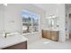 Bathroom features double vanities with modern fixtures and a large window at 200 Regency Ridge Dr, Holly Springs, NC 27540