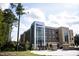 Modern multi-story brick building with extensive window lines and professional landscaping at 200 Regency Ridge Dr, Holly Springs, NC 27540