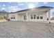 House exterior showcasing a covered patio and well-manicured lawn at 200 Regency Ridge Dr, Holly Springs, NC 27540