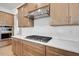 Modern kitchen showcases white countertops, designer backsplash and stainless steel appliances at 200 Regency Ridge Dr, Holly Springs, NC 27540