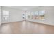 Bright living room with large windows offering ample natural light and scenic views at 200 Regency Ridge Dr, Holly Springs, NC 27540