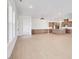 Spacious living room with an open floor plan and hardwood floors leading to the kitchen at 200 Regency Ridge Dr, Holly Springs, NC 27540