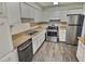 Kitchen with stainless steel appliances and light wood cabinets at 250 S Estes Dr # Apt 94, Chapel Hill, NC 27514