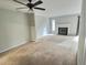 Living room with fireplace and carpet at 250 S Estes Dr # Apt 94, Chapel Hill, NC 27514