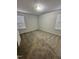 Well-lit bedroom with neutral walls and carpet flooring at 288 Rosa Cir, Willow Springs, NC 27592
