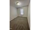 Bright bedroom with ample space and a window with blinds at 288 Rosa Cir, Willow Springs, NC 27592