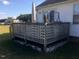Wooden deck with lattice panels in the backyard of a home at 288 Rosa Cir, Willow Springs, NC 27592