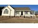 White house with gray shutters and a covered porch at 288 Rosa Cir, Willow Springs, NC 27592