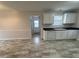 Kitchen features white cabinets, tile floors and exterior door access at 288 Rosa Cir, Willow Springs, NC 27592