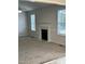Spacious living room with a fireplace and neutral carpeting at 288 Rosa Cir, Willow Springs, NC 27592