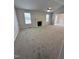 Spacious living room featuring a fireplace and large windows at 288 Rosa Cir, Willow Springs, NC 27592
