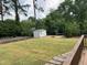 Expansive backyard showcasing a storage shed, firepit, and garden area at 317 Compton Rd, Raleigh, NC 27609