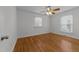 Well-lit bedroom with hardwood floors and window blinds at 317 Compton Rd, Raleigh, NC 27609