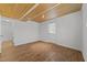 Bright and spacious bedroom with wood ceiling, vinyl flooring, and ample natural light at 317 Compton Rd, Raleigh, NC 27609