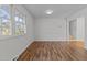Bright dining room with hardwood floors and view to stairs at 317 Compton Rd, Raleigh, NC 27609