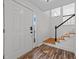 Entryway with hardwood floors, white door and staircase at 317 Compton Rd, Raleigh, NC 27609