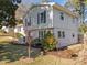 Side view of a light-grey two story house with landscaping at 317 Compton Rd, Raleigh, NC 27609