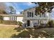 Two-story house with gray siding, landscaping, and a black front door at 317 Compton Rd, Raleigh, NC 27609