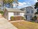 Rear view of a two-story house with gray siding and a driveway at 317 Compton Rd, Raleigh, NC 27609