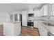 Updated kitchen with stainless steel appliances and island at 317 Compton Rd, Raleigh, NC 27609