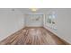 Spacious living room with hardwood floors and large windows at 317 Compton Rd, Raleigh, NC 27609