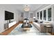 Bright living room with hardwood floors and large bay window at 317 Compton Rd, Raleigh, NC 27609